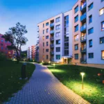Property lease-up apartment complex at dusk