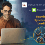 man wearing glasses sitting at his desk working on a laptop with a CRM integration GIF promoting the Conversion and Anyone Home integration